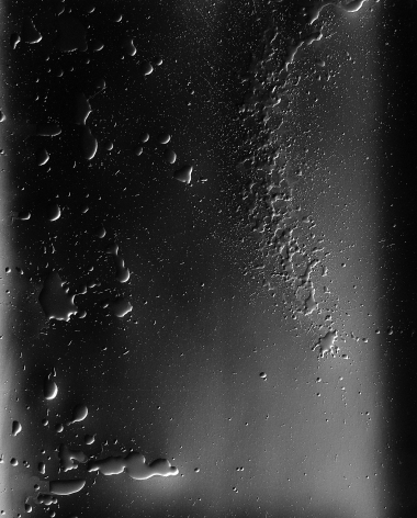 Ben Nixon  Sea Change, 2016  Silver Gelatin Photogram  24h x 20w in. a photogram depicting droplets and splatter marks in a greyscale color scheme