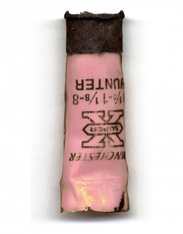 Colby Caldwell  Spent (99), 2012/2017  Archival Pigment Print  44h x 22w in 111.76h x 55.88w cm  Edition of 5  CC_007, color photograph of a pink, winchester (Hunter) shotgun shell