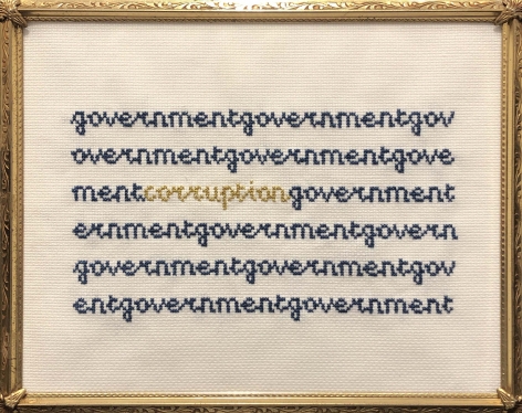 Kirsten Stolle  Inside Government Corruption, 2014  Embroidery floss on aida cloth in a vintage frame  9h x 12w in -words embroidered in blue and yellow with the word Corruption popping out in yellow