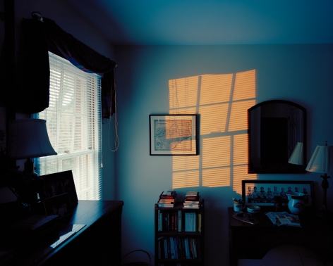 McNair Evans  Floodlights from the series Confessions for a Son  Archival Pigment Print photograph of a blue room with a warm light coming in from the window to the left
