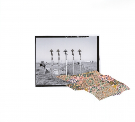 Kirsten Stolle  Escape Hatch, from the series "Disarm:, 2016  collage on archival pigment print  15h x 16 1/2w in  Unique, gelatin silver print of a military base with a colorful collage element.